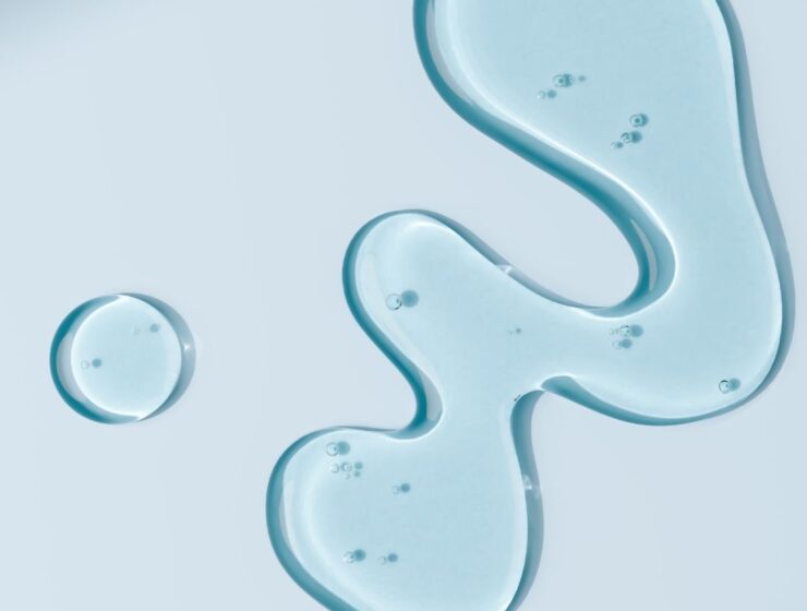 Close up of blue oil on a glass.