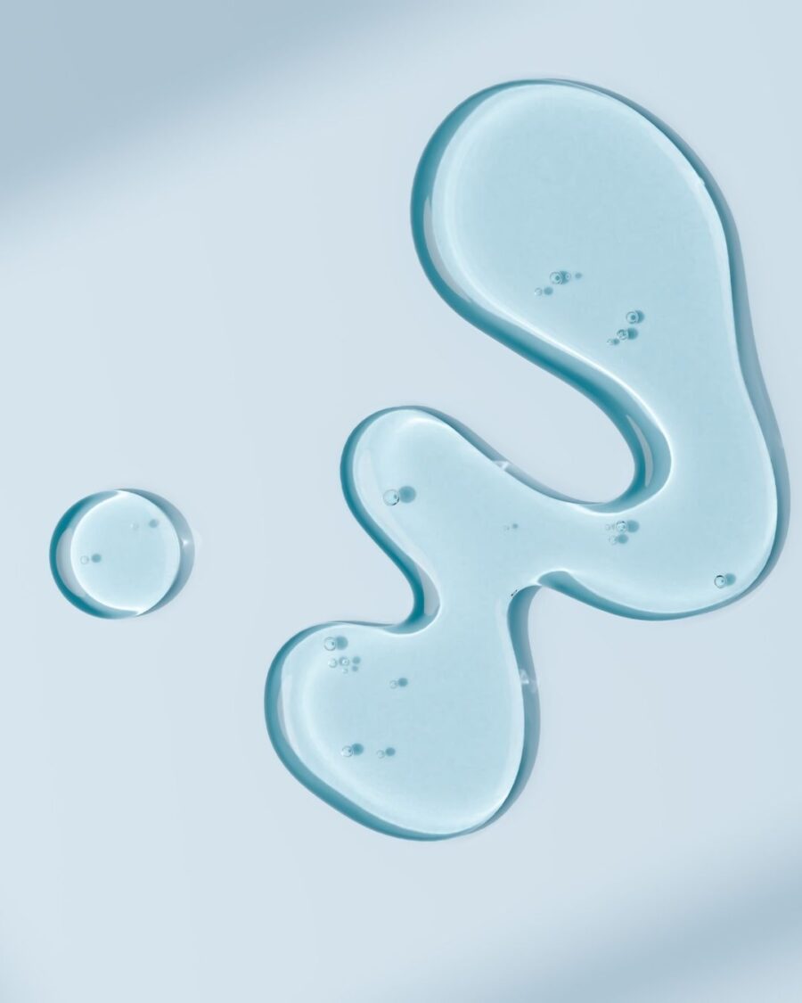 Close up of blue oil on a glass.