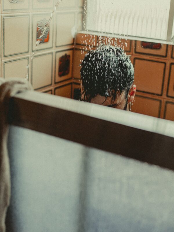 Person Washing Hair in the Shower.