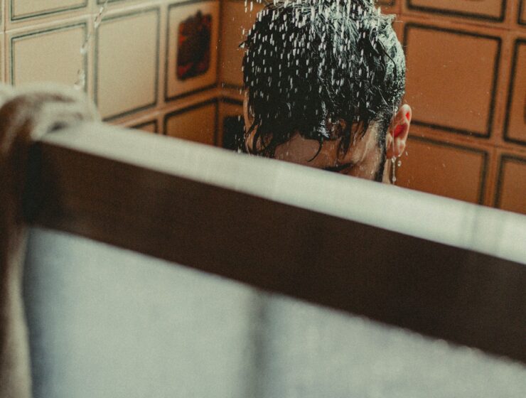 Person Washing Hair in the Shower.