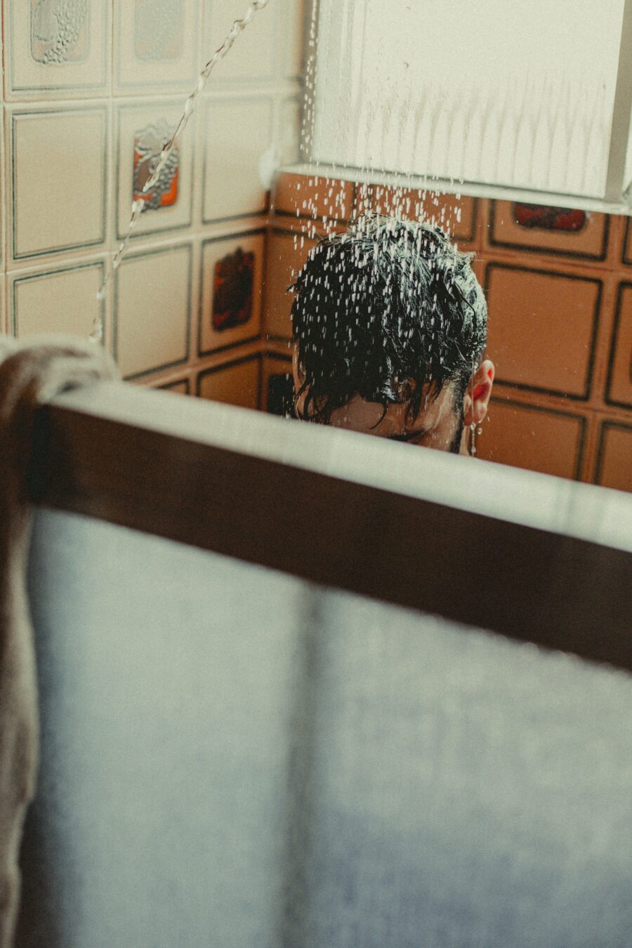 Person Washing Hair in the Shower.