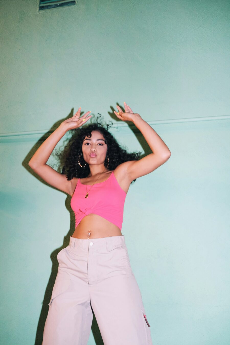 Woman dancing with curly hair