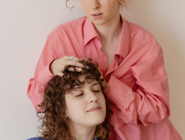 Women with curly hair posing