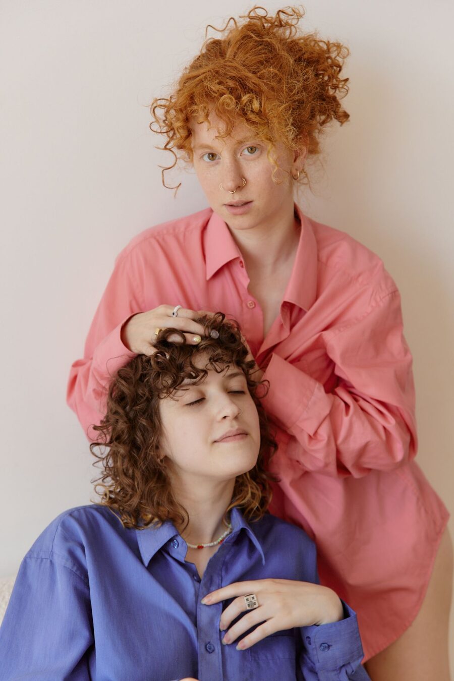 Women with curly hair posing