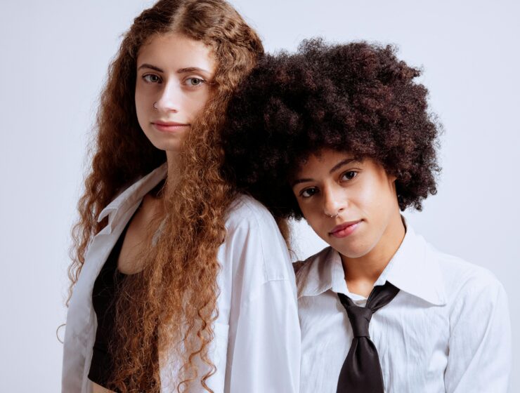 Two women with curly hair.