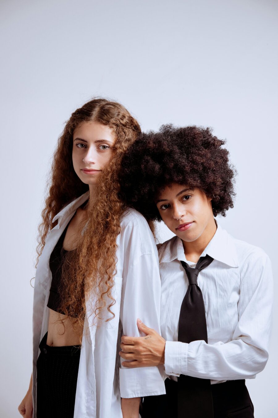 Two women with curly hair.