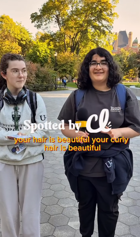 Two women with curly hair being interviewed by Curly Lifestyles